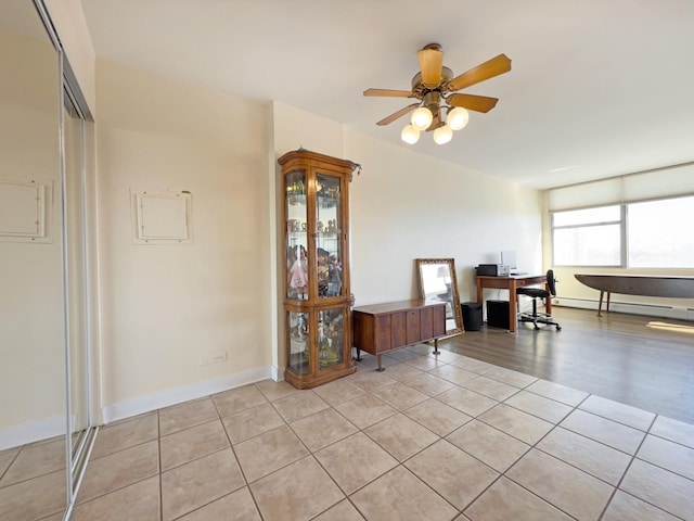 33 N Main St Unit 4J, Lombard, IL 60148 - dining area featuring ceiling fan, light tile patterned flooring, a baseboard radiator, and an office area