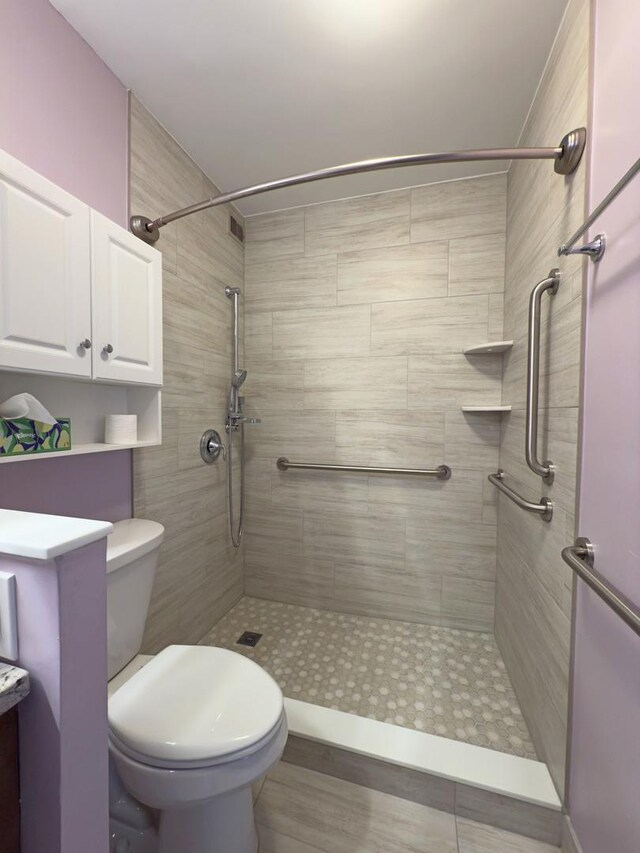 33 N Main St Unit 4J, Lombard, IL 60148 - bathroom featuring tiled shower and toilet