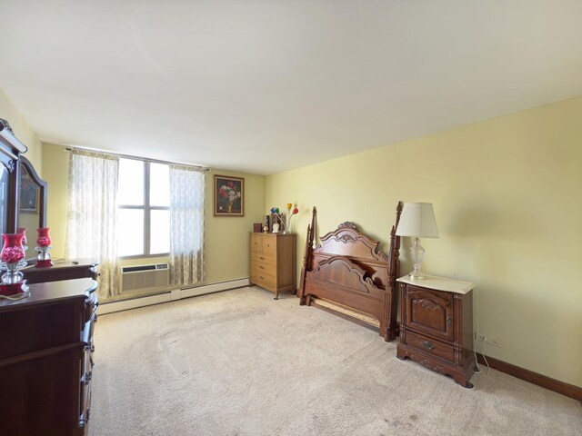 33 N Main St Unit 4J, Lombard, IL 60148 - bedroom with a baseboard radiator and light colored carpet