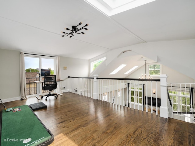 1344 W George St Unit 3, Chicago, IL 60657 - office space featuring wood finished floors, healthy amount of natural light, a chandelier, lofted ceiling, and baseboards