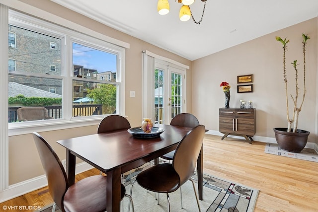 1513 W Highland Ave, Chicago, IL 60660 - dining room with a chandelier and light wood finished floors