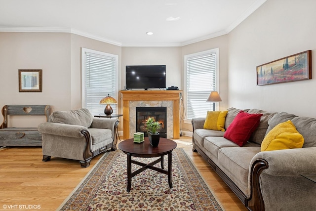 1513 W Highland Ave, Chicago, IL 60660 - living area featuring light wood-style flooring, crown molding, a premium fireplace, and recessed lighting