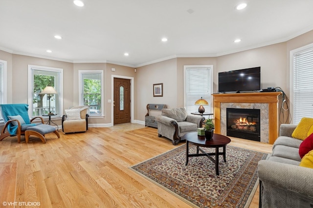 1513 W Highland Ave, Chicago, IL 60660 - living area featuring recessed lighting, wood finished floors, a high end fireplace, and crown molding