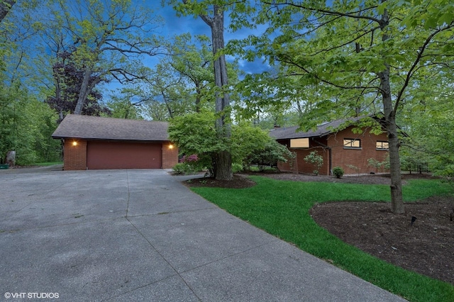 1543 Shawnee Trl, Riverwoods, IL 60015 - view of front facade featuring brick siding, concrete driveway, a front lawn, and an attached garage
