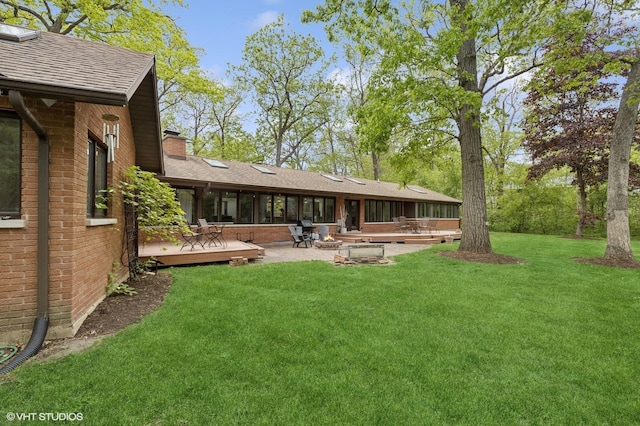 1543 Shawnee Trl, Riverwoods, IL 60015 - back of property featuring brick siding, a wooden deck, a chimney, and a yard