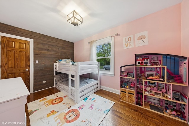 5112 N Canfield Ave, Norridge, IL 60706 - bedroom featuring wood walls, wood finished floors, and baseboards