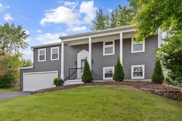 104 N Braintree Dr, Schaumburg, IL 60194 - raised ranch with an attached garage, driveway, and a front lawn