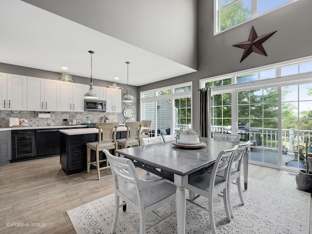 1016 Hummingbird Way, Bartlett, IL 60103 - dining area featuring light wood-style floors, recessed lighting, and a high ceiling