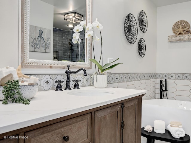 1016 Hummingbird Way, Bartlett, IL 60103 - bathroom featuring vanity, wainscoting, a freestanding bath, tile walls, and a tile shower