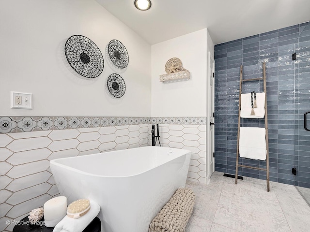 1016 Hummingbird Way, Bartlett, IL 60103 - full bath with tile walls, a freestanding bath, a wainscoted wall, and a tile shower