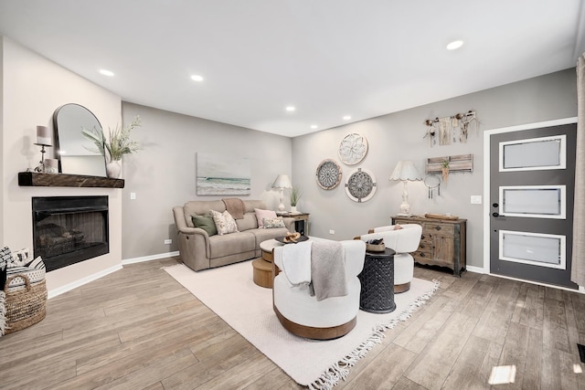 1016 Hummingbird Way, Bartlett, IL 60103 - living room featuring light wood finished floors, a fireplace, recessed lighting, and baseboards