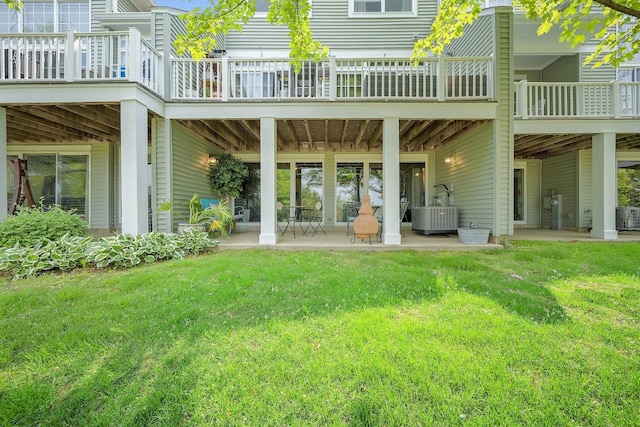 1016 Hummingbird Way, Bartlett, IL 60103 - rear view of house with a patio area, a lawn, and central AC