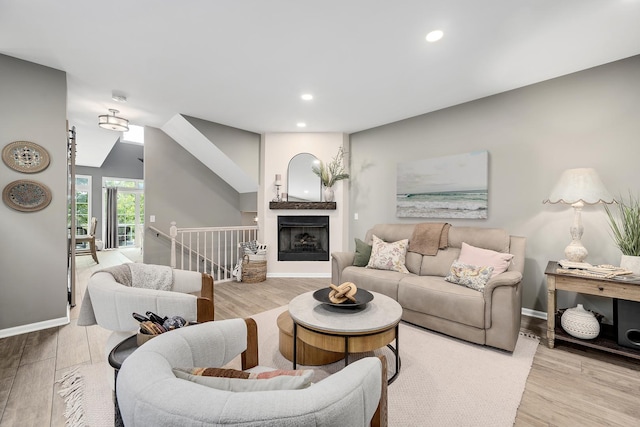 1016 Hummingbird Way, Bartlett, IL 60103 - living area with wood finished floors, recessed lighting, baseboards, and a fireplace with raised hearth