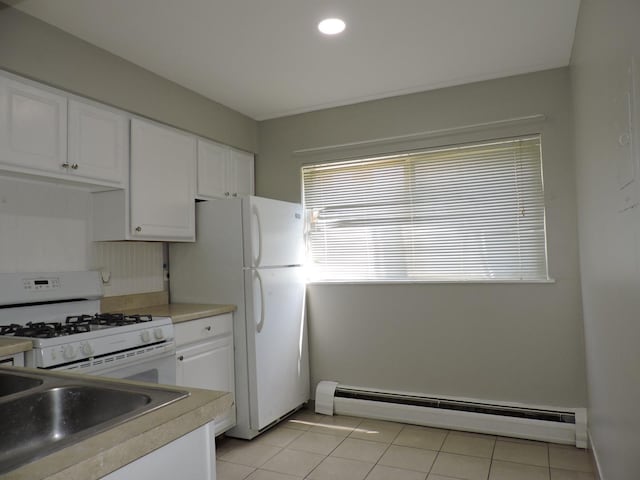 703 E Fullerton Ave Unit 1-110, Glendale Heights, IL 60139 - kitchen featuring a baseboard heating unit, white appliances, white cabinetry, light countertops, and light tile patterned flooring