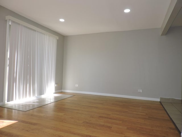703 E Fullerton Ave Unit 1-110, Glendale Heights, IL 60139 - empty room featuring wood finished floors and recessed lighting