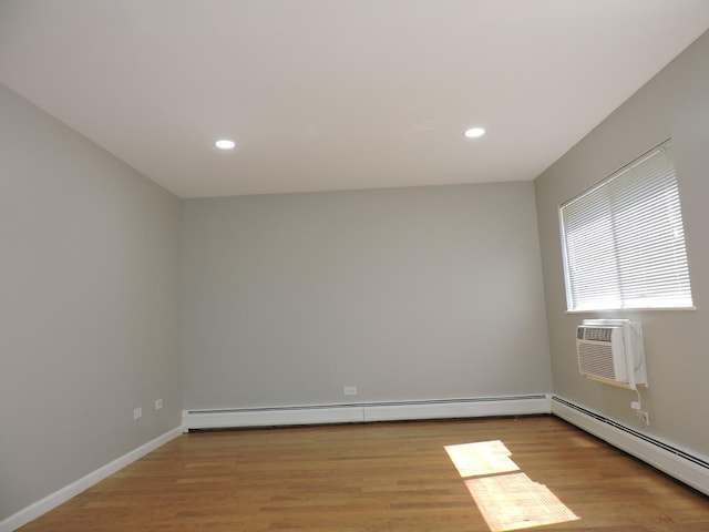 703 E Fullerton Ave Unit 1-110, Glendale Heights, IL 60139 - empty room with light wood-style floors, recessed lighting, baseboard heating, and a wall unit AC