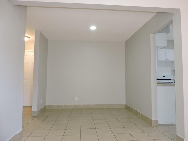 703 E Fullerton Ave Unit 1-110, Glendale Heights, IL 60139 - unfurnished room featuring light tile patterned floors and recessed lighting
