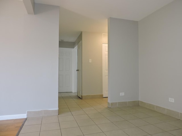 703 E Fullerton Ave Unit 1-110, Glendale Heights, IL 60139 - empty room featuring light tile patterned flooring and baseboards