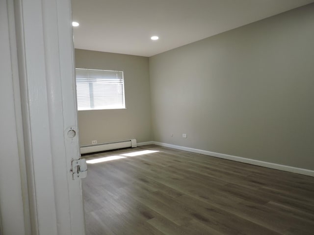 703 E Fullerton Ave Unit 1-110, Glendale Heights, IL 60139 - empty room with baseboard heating, dark wood-style flooring, and recessed lighting