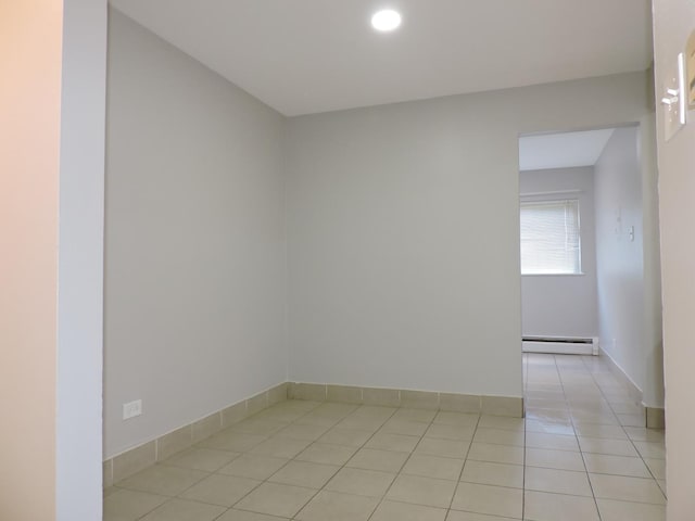 703 E Fullerton Ave Unit 1-110, Glendale Heights, IL 60139 - empty room with a baseboard radiator, light tile patterned floors, and recessed lighting
