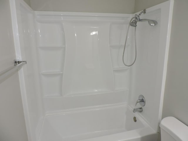 703 E Fullerton Ave Unit 1-110, Glendale Heights, IL 60139 - bathroom featuring toilet and bathtub / shower combination