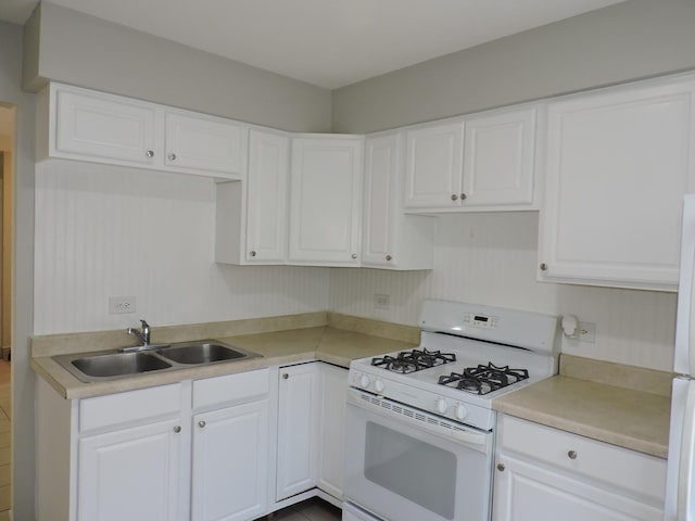 703 E Fullerton Ave Unit 1-110, Glendale Heights, IL 60139 - kitchen with white gas range oven, white cabinets, and light countertops