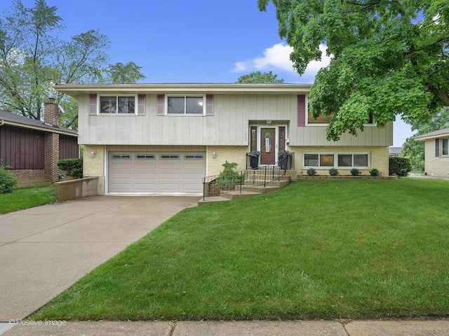 625 N Dupage Ave, Addison, IL 60101 - split foyer home with a garage, driveway, a front yard, and brick siding
