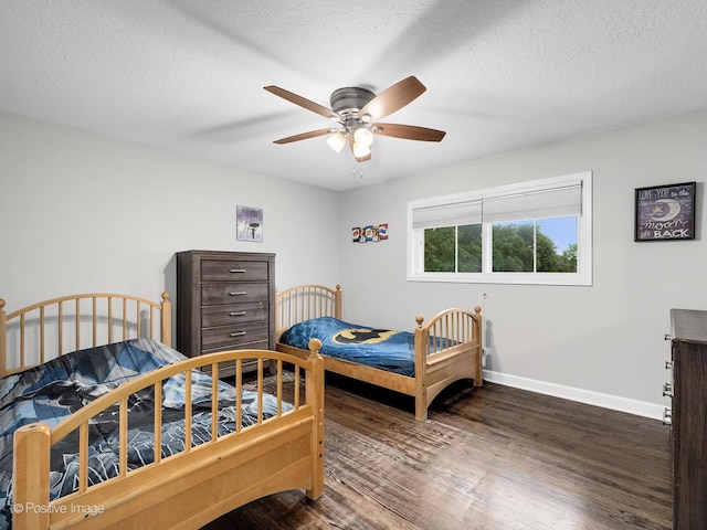 625 N Dupage Ave, Addison, IL 60101 - bedroom with wood finished floors, baseboards, ceiling fan, and a textured ceiling