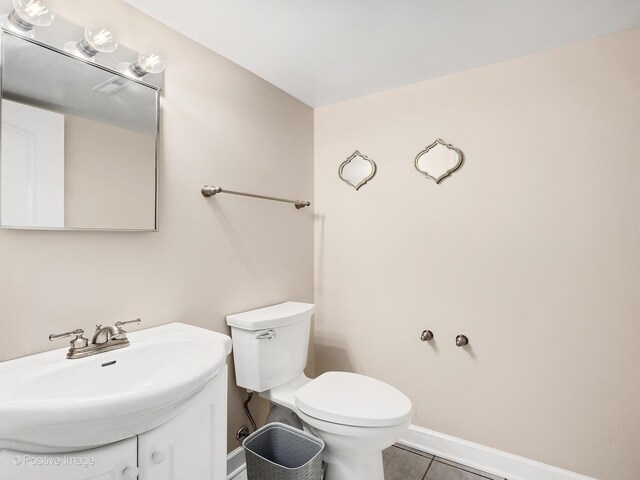 625 N Dupage Ave, Addison, IL 60101 - bathroom featuring toilet, tile patterned flooring, vanity, and baseboards