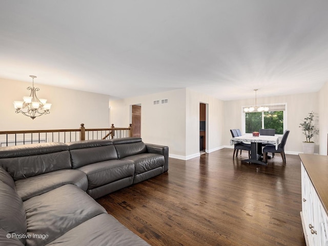 625 N Dupage Ave, Addison, IL 60101 - living area featuring a chandelier, dark wood-style floors, and baseboards