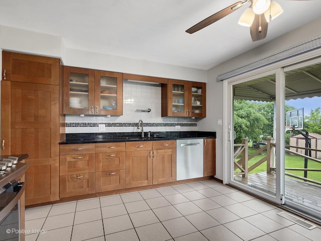 625 N Dupage Ave, Addison, IL 60101 - kitchen featuring stainless steel dishwasher, a sink, decorative backsplash, a ceiling fan, and brown cabinetry