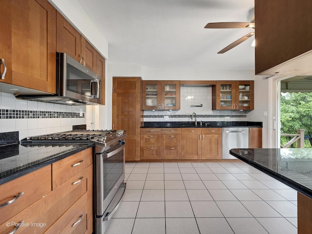 625 N Dupage Ave, Addison, IL 60101 - kitchen with appliances with stainless steel finishes, a ceiling fan, tasteful backsplash, a sink, and brown cabinets