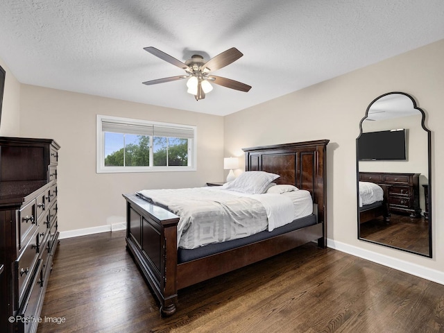 625 N Dupage Ave, Addison, IL 60101 - bedroom featuring dark wood-style floors, baseboards, a textured ceiling, and a ceiling fan