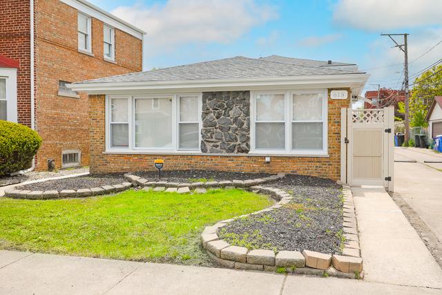 615 E 101st Pl, Chicago, IL 60628 - view of front facade featuring brick siding, a gate, and roof with shingles