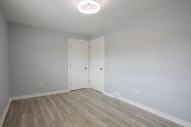 615 E 101st Pl, Chicago, IL 60628 - empty room with wood finished floors and baseboards