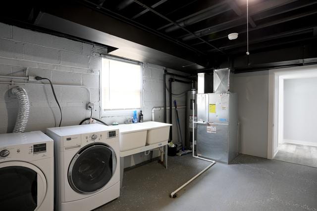 615 E 101st Pl, Chicago, IL 60628 - laundry area with washing machine and clothes dryer, electric water heater, and heating unit