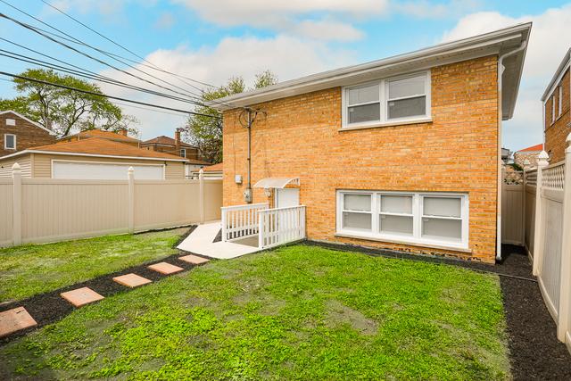 615 E 101st Pl, Chicago, IL 60628 - back of house featuring brick siding