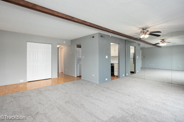9105 S Roberts Rd Unit 1A, Hickory Hills, IL 60457 - unfurnished living room featuring carpet flooring, ceiling fan, and a textured ceiling
