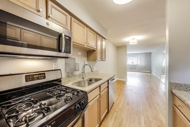 1415 W Lunt Ave Unit 203, Chicago, IL 60626 - kitchen featuring stainless steel appliances, a sink, light wood-style floors, light stone countertops, and light brown cabinets