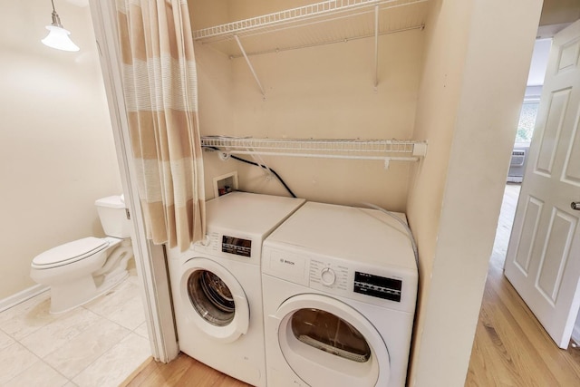 1415 W Lunt Ave Unit 203, Chicago, IL 60626 - laundry area with separate washer and dryer and light wood-style floors