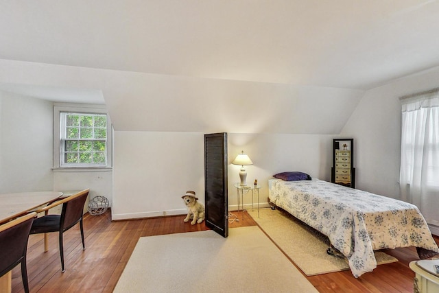 10752 S Washtenaw Ave, Chicago, IL 60655 - bedroom featuring wood finished floors, vaulted ceiling, and baseboards