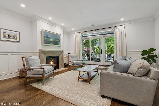 843 W Buckingham Pl Unit 1W, Chicago, IL 60657 - living room with a decorative wall, a high end fireplace, wood finished floors, wainscoting, and ornamental molding