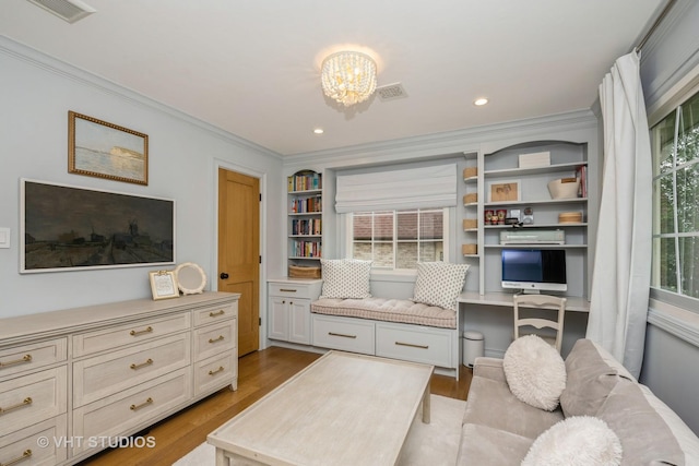 623 Cumnor Ave, Barrington, IL 60010 - living area featuring ornamental molding, wood finished floors, a chandelier, built in features, and recessed lighting