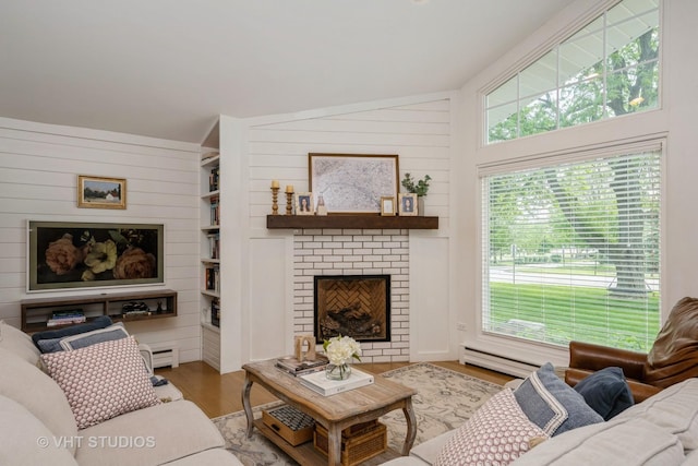 623 Cumnor Ave, Barrington, IL 60010 - living room featuring wood finished floors, plenty of natural light, lofted ceiling, a brick fireplace, and baseboard heating