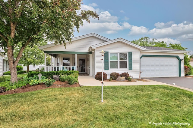 611 Filly Ln, Grayslake, IL 60030 - single story home with a porch, a garage, concrete driveway, and a front lawn