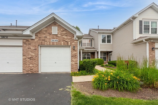 24149 W Pear Tree Cir Unit A, Plainfield, IL 60585 - view of front of home featuring brick siding and driveway