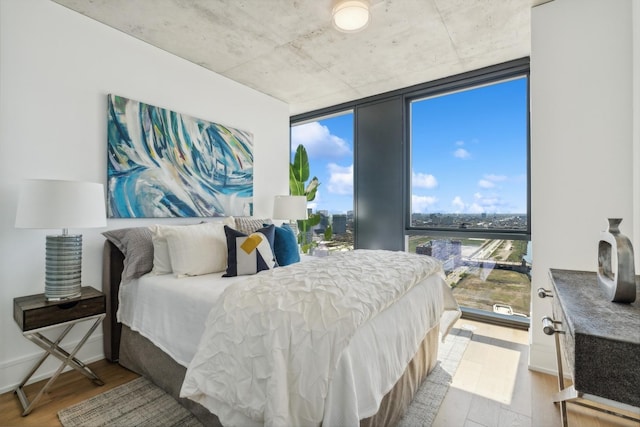 234 W Polk St Unit 2907, Chicago, IL 60607 - bedroom featuring wood finished floors and a wall of windows