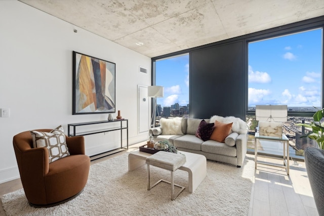 234 W Polk St Unit 2907, Chicago, IL 60607 - living room with wood finished floors, a wall of windows, plenty of natural light, and a city view