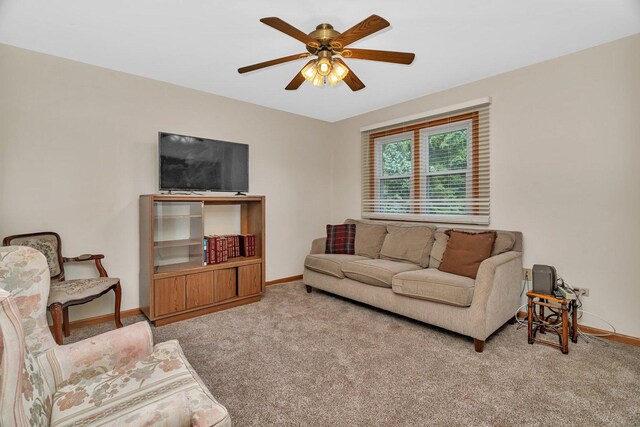 1072 Ronald Dr, Joliet, IL 60435 - living area with carpet flooring, a ceiling fan, and baseboards