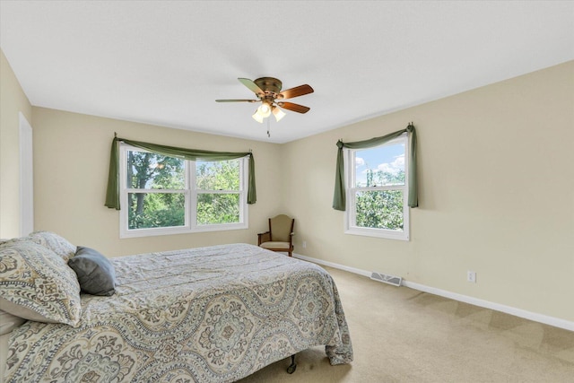 309 E Mchenry St, Urbana, IL 61801 - carpeted bedroom with baseboards and ceiling fan